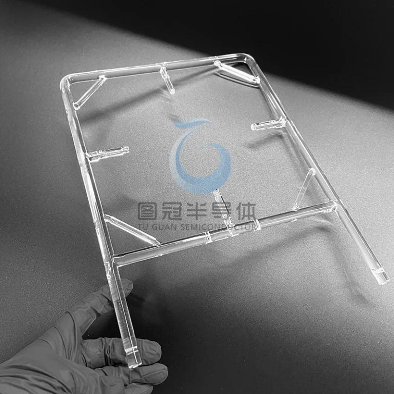Clear Fused Quartz support frame with multiple angled bars and flat mounting points, held by a gloved hand