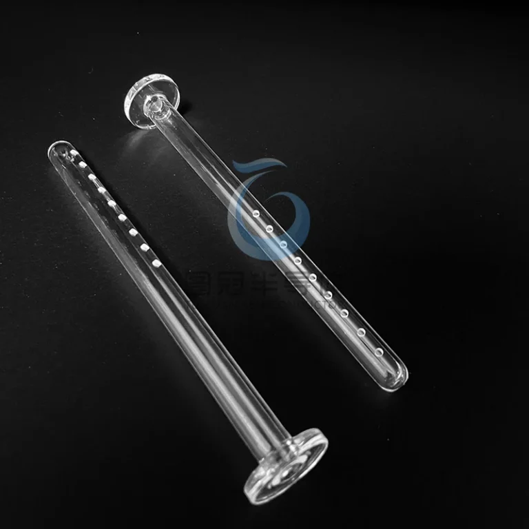 Two clear fused silica linear spray nozzles with multiple precision holes and flat bases