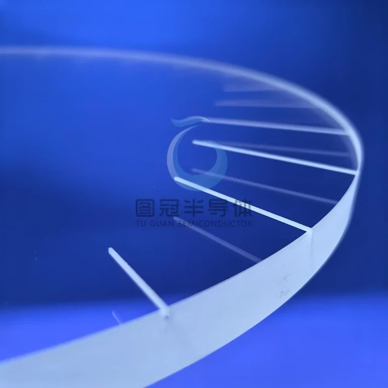 Clear, circular 12-inch Fused Quartz vacuum suction disc with internal etched radial lines, angled on a blue surface