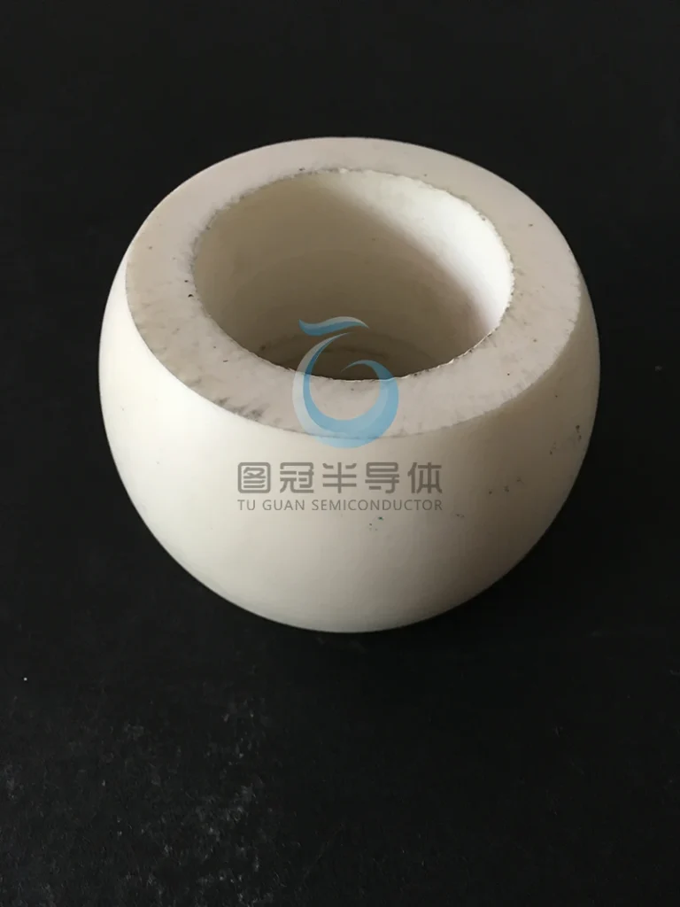 Small, spherical ceramic vessel with a wide opening.