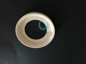 Custom-formed ceramic ring with a flared or conical inner profile.