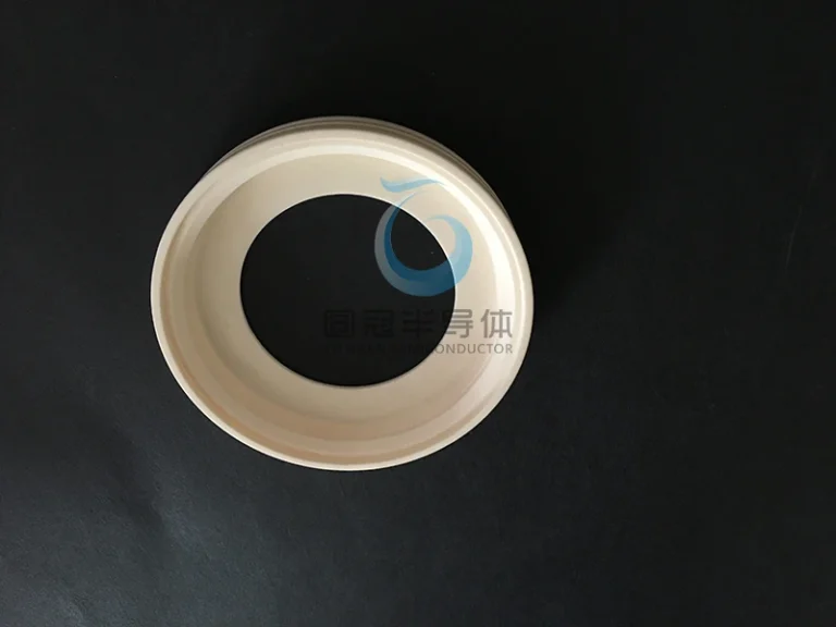 Custom-formed ceramic ring with a flared or conical inner profile.