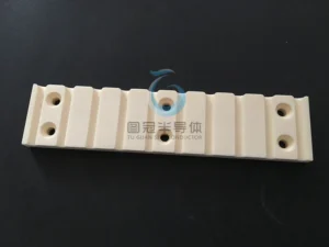 Top view of a precision ceramic plate with multiple horizontal slots.