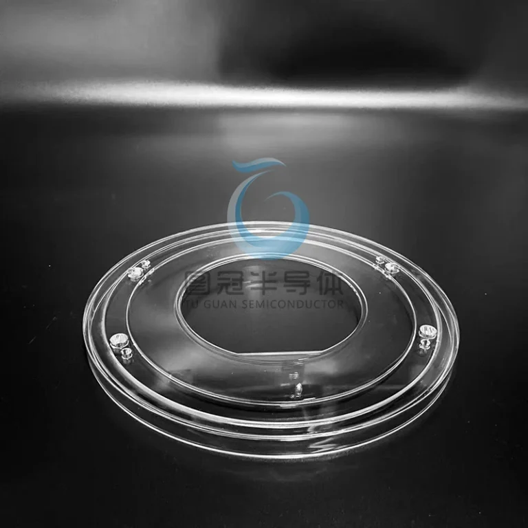 Clear Fused Quartz ring cover with concentric circles, an oval central opening, and perimeter holes