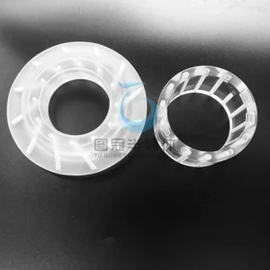 Two Fused Quartz support rings, one larger with internal fins, one smaller with cylindrical internal supports.